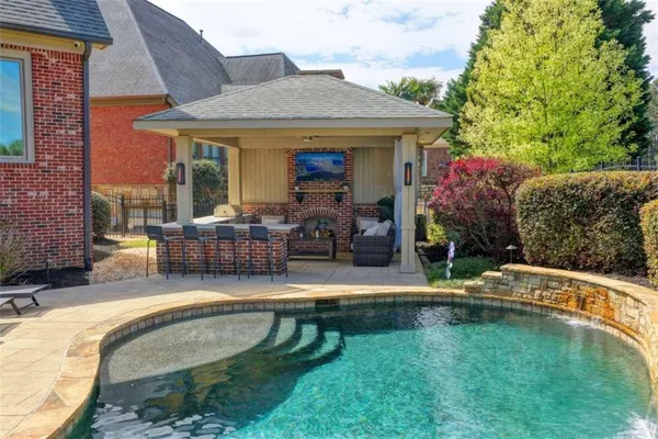 a kitchen with stainless steel appliances granite countertop a sink and cabinets