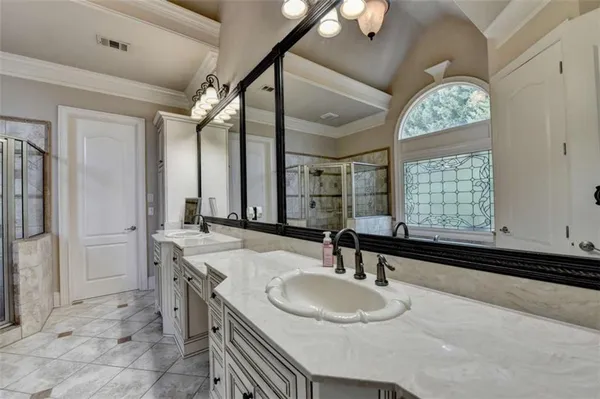 a bathroom with a granite countertop sink a toilet and a mirror
