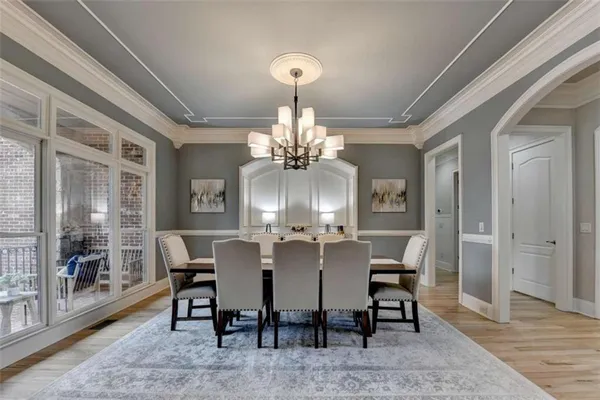 a view of a room with furniture and wooden floor
