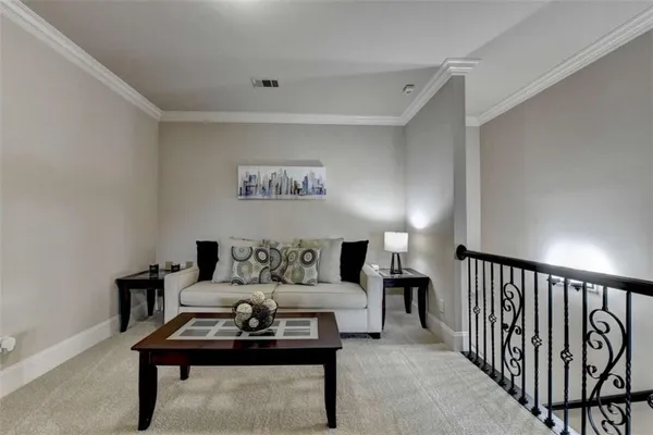 a living room with patio fireplace furniture and a flat screen tv