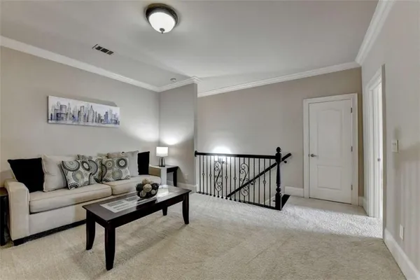 a view of a swimming pool and a chairs in patio
