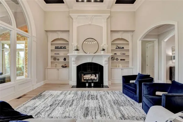 a kitchen with white cabinets and a stove