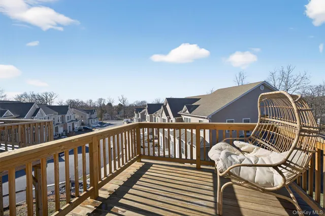 a view of a balcony with chairs