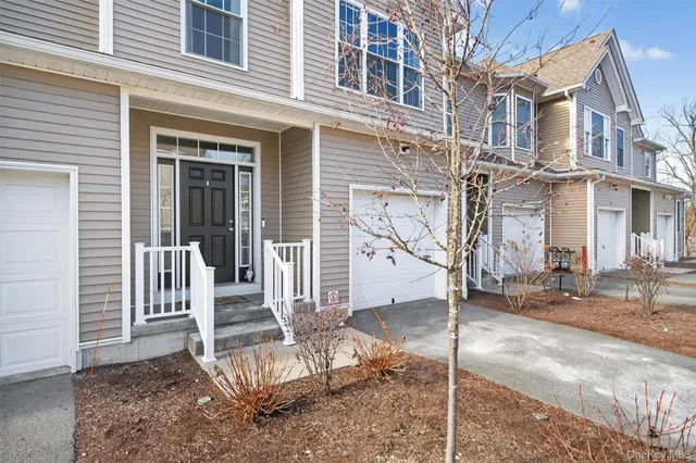 a view of a building with a tree in front
