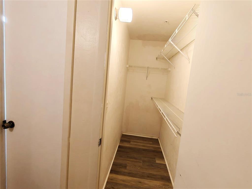4000 Southwest 23rd Street, Unit 5207 ROOM A Gainesville, FL 32608 - Photo 13 of 17 a view of a hallway with wooden floor