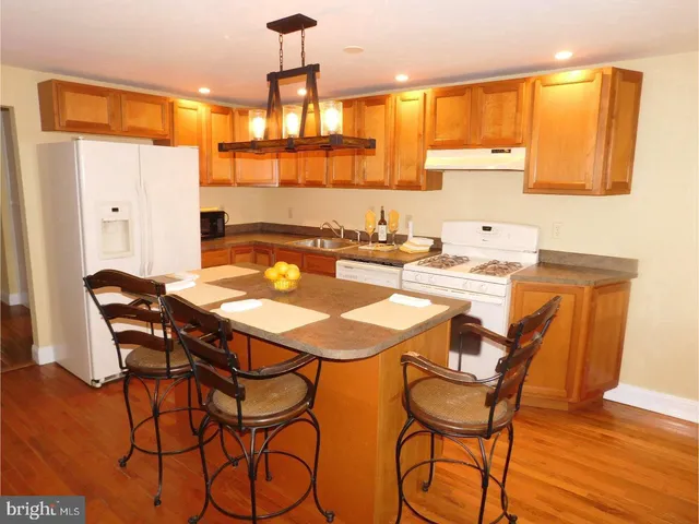 a dining room with a table and chairs