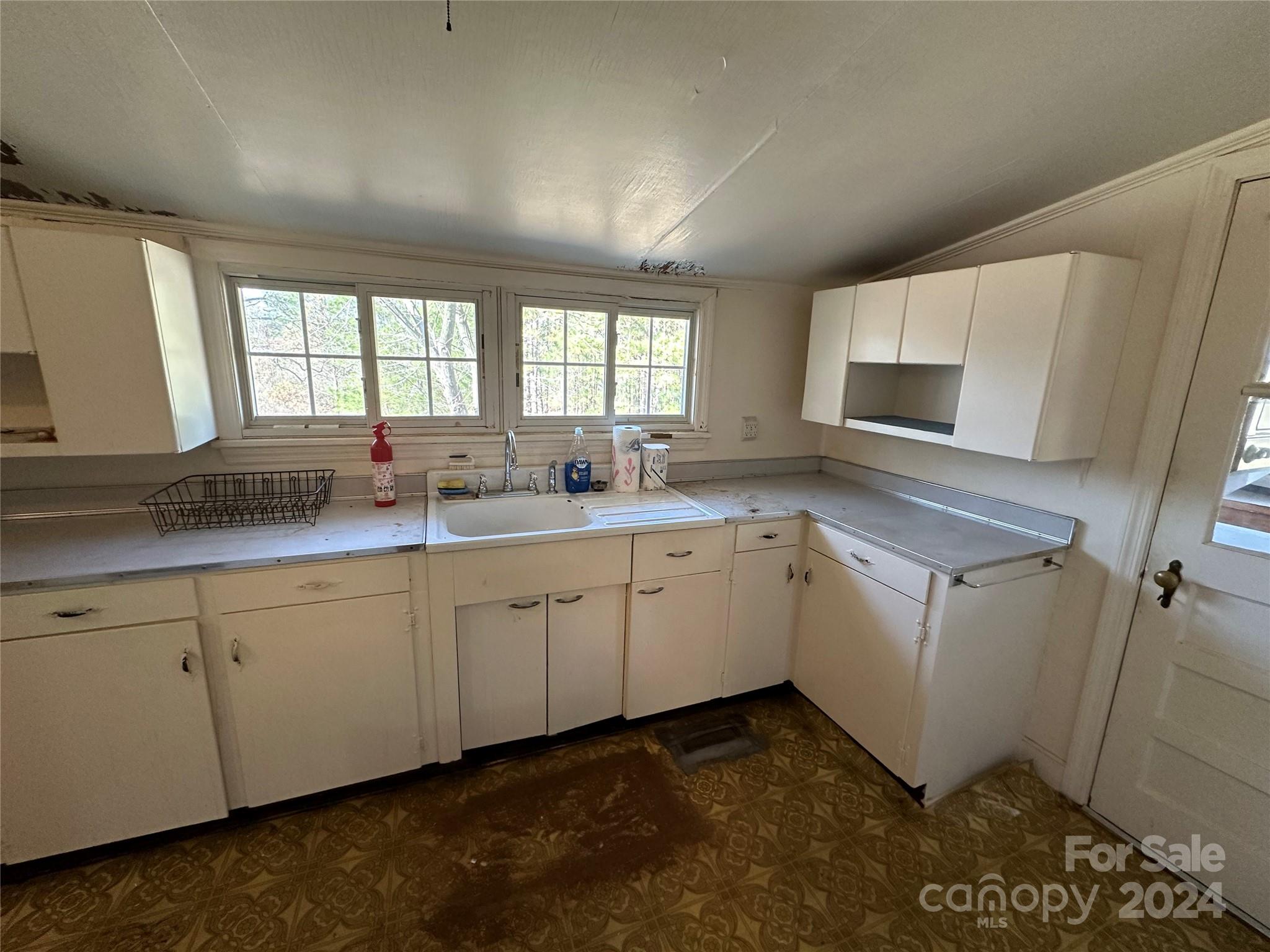 11298 Highway 265 Jefferson, SC 29718 - Photo 12 of 22 a kitchen with sink cabinets and window