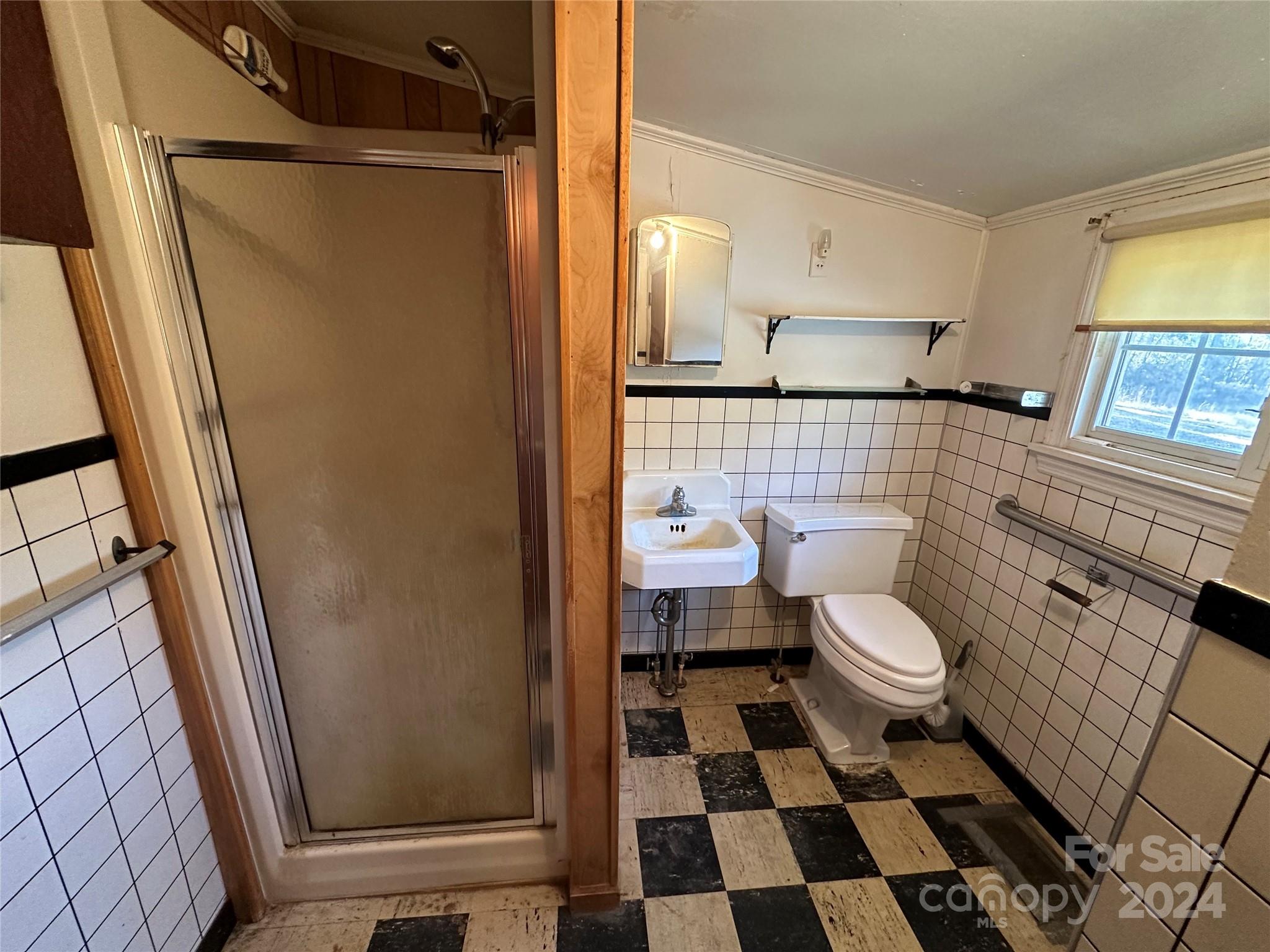 11298 Highway 265 Jefferson, SC 29718 - Photo 16 of 22 a bathroom with a toilet and a shower
