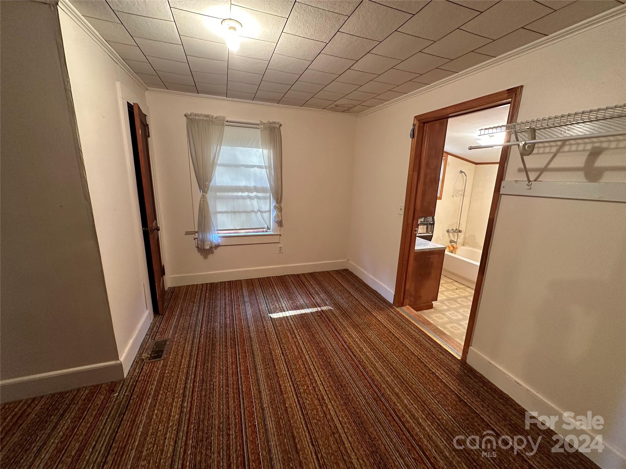 11298 Highway 265 Jefferson, SC 29718 - Photo 18 of 22 a view of empty room with wooden floor and fan
