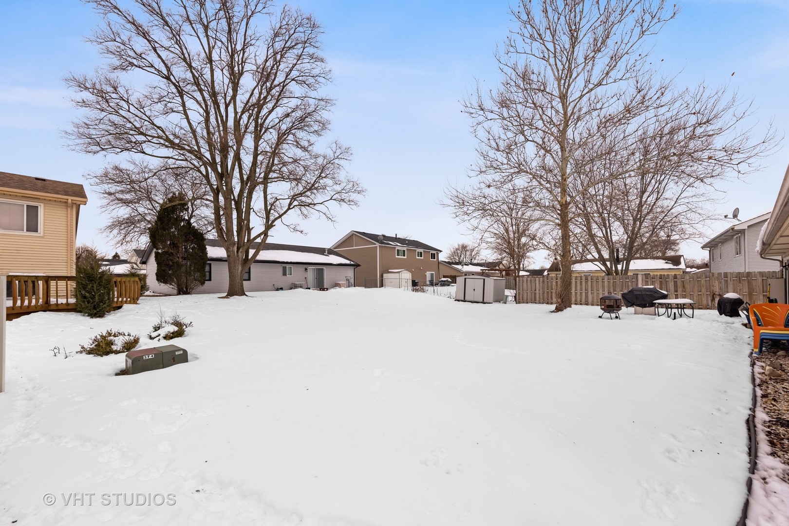 651 Rockhurst Road Bolingbrook, IL 60440 - Photo 14 of 15 a view of a house with snow on the roadside