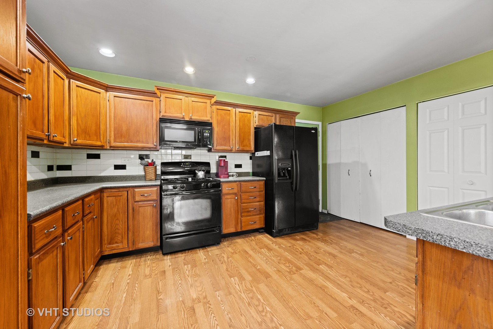 651 Rockhurst Road Bolingbrook, IL 60440 - Photo 5 of 15 a kitchen with stainless steel appliances granite countertop a refrigerator a stove top oven a sink and dishwasher