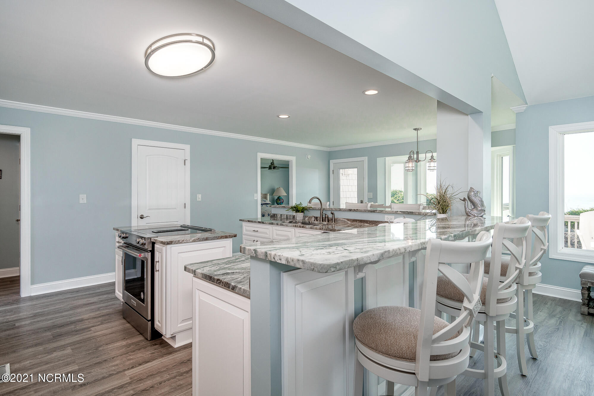 703 Salter Path Road Indian Beach, NC 28512 - Photo 13 of 62 Kitchen w/ island and peninsula seating