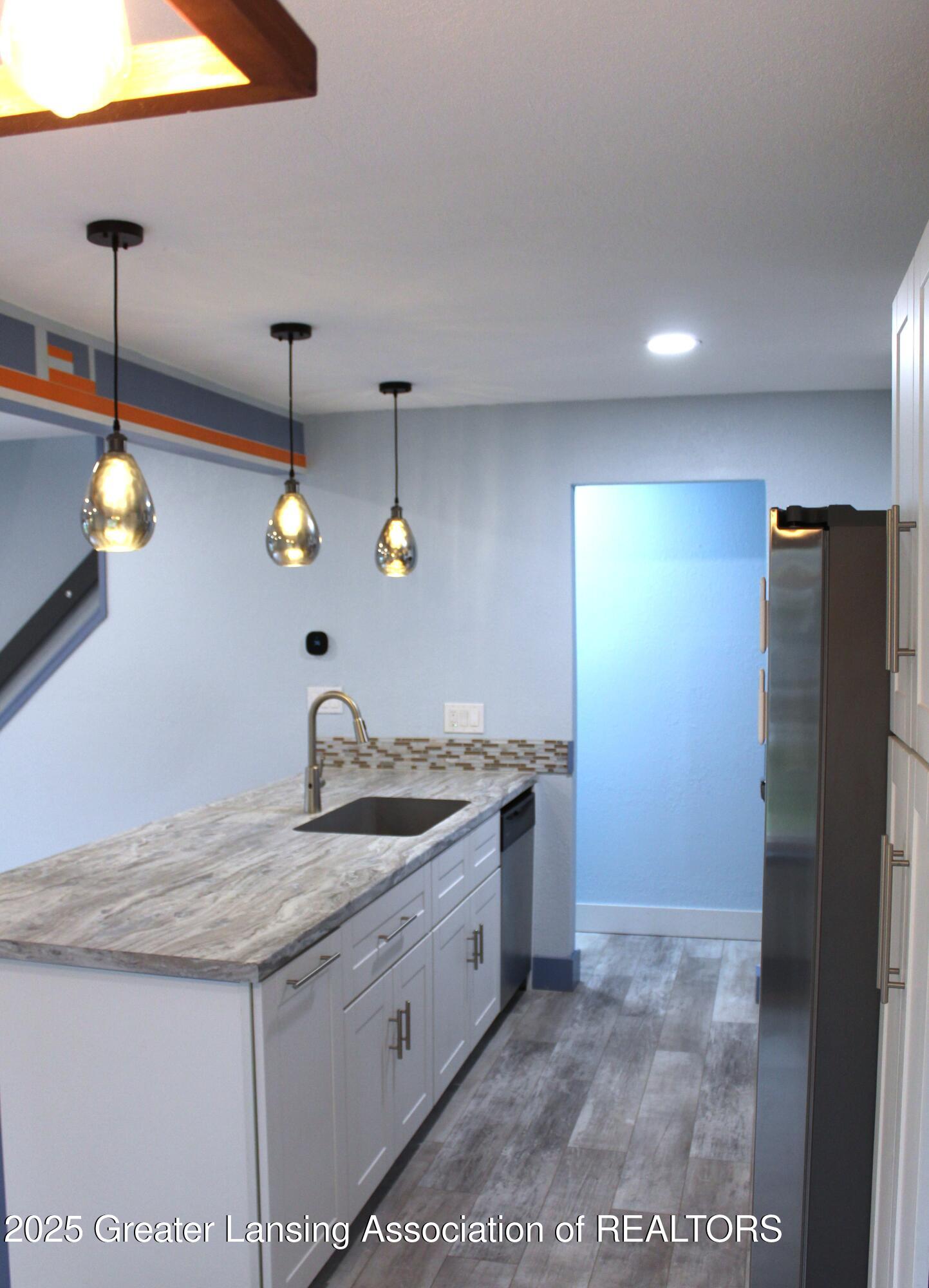 3922 Hunters Ridge Drive, Unit 3 Lansing, MI 48911 - Photo 9 of 44 kitchen