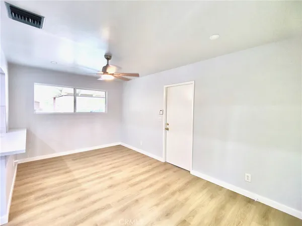 a large kitchen with stainless steel appliances granite countertop a stove refrigerator a sink dishwasher with a dining table and chairs