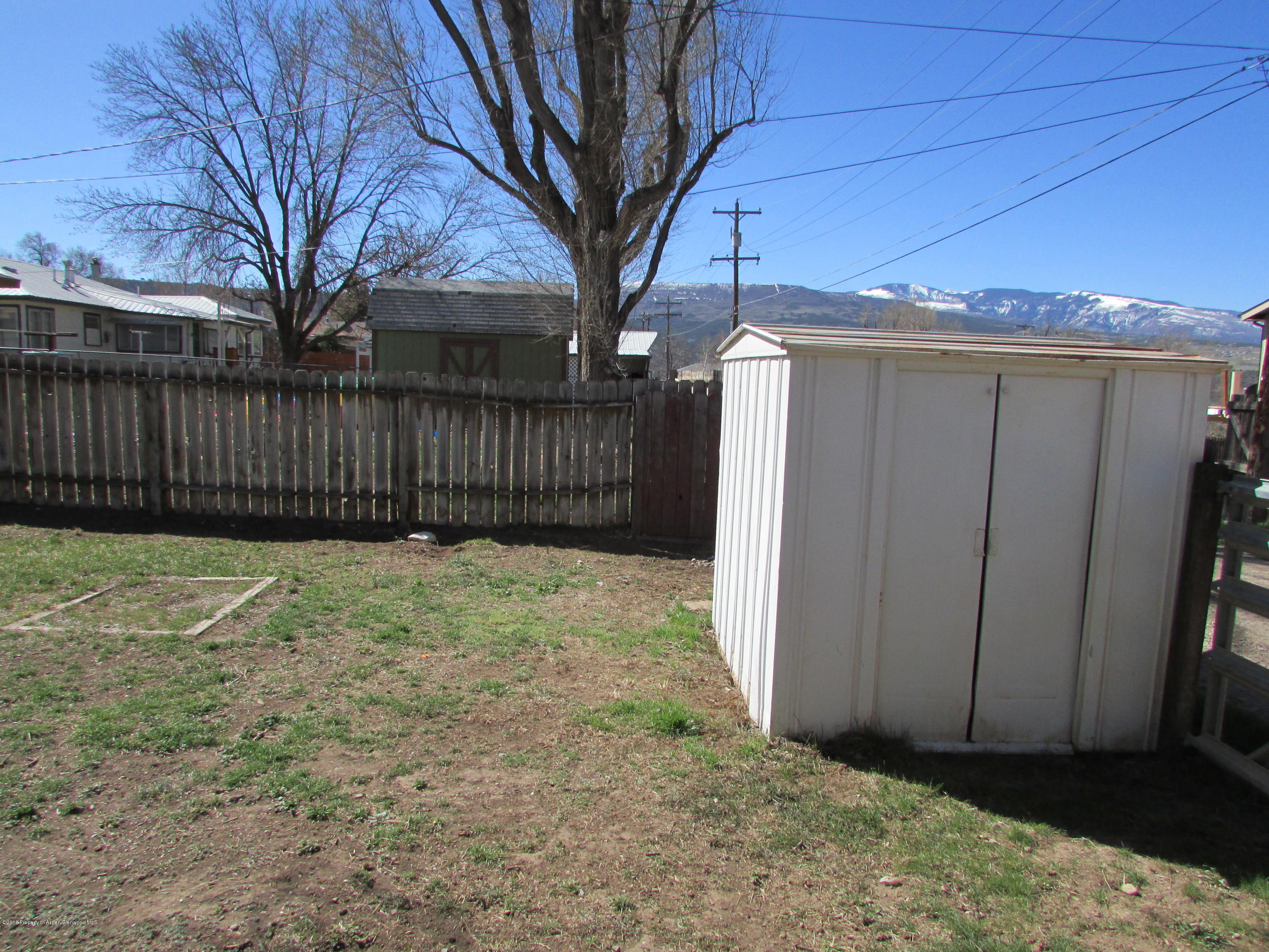 405 Elm Avenue Rifle, CO 81650 - Photo 11 of 14 a view of a backyard of the house
