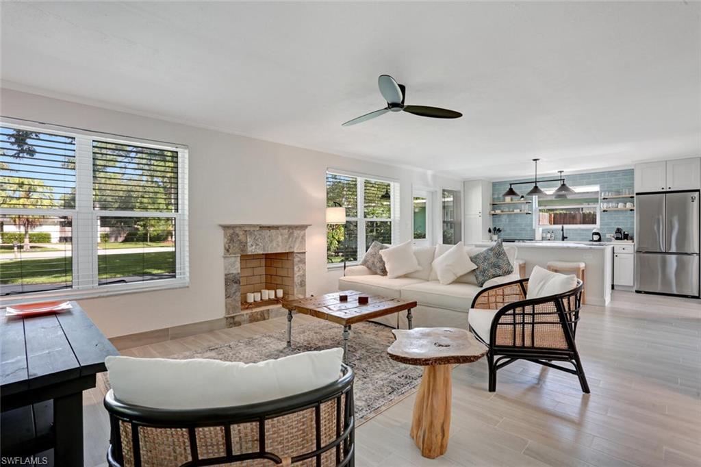982 13th Street North Naples, FL 34102 - Photo 11 of 29 a living room with furniture and a large window