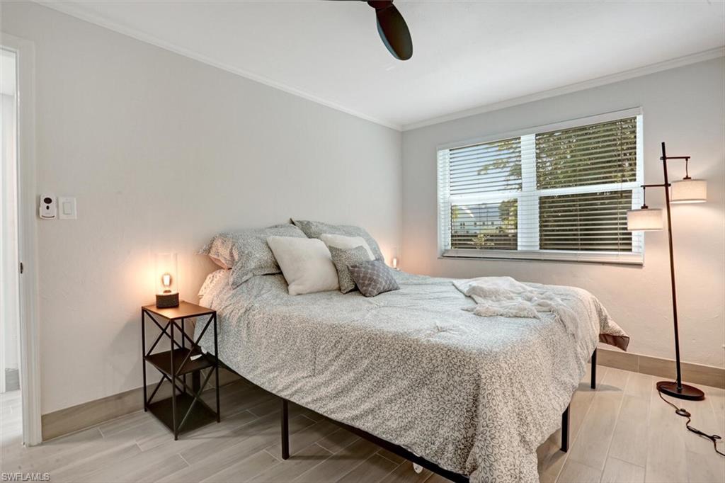 982 13th Street North Naples, FL 34102 - Photo 12 of 29 a bedroom with a bed and a window