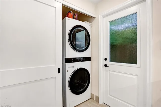 a view of a hallway with washer and dryer