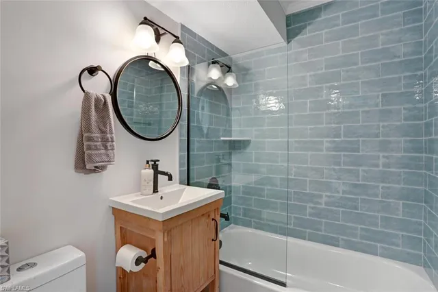 a bathroom with a sink a toilet and a bathtub