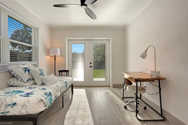 a bedroom with furniture and a window