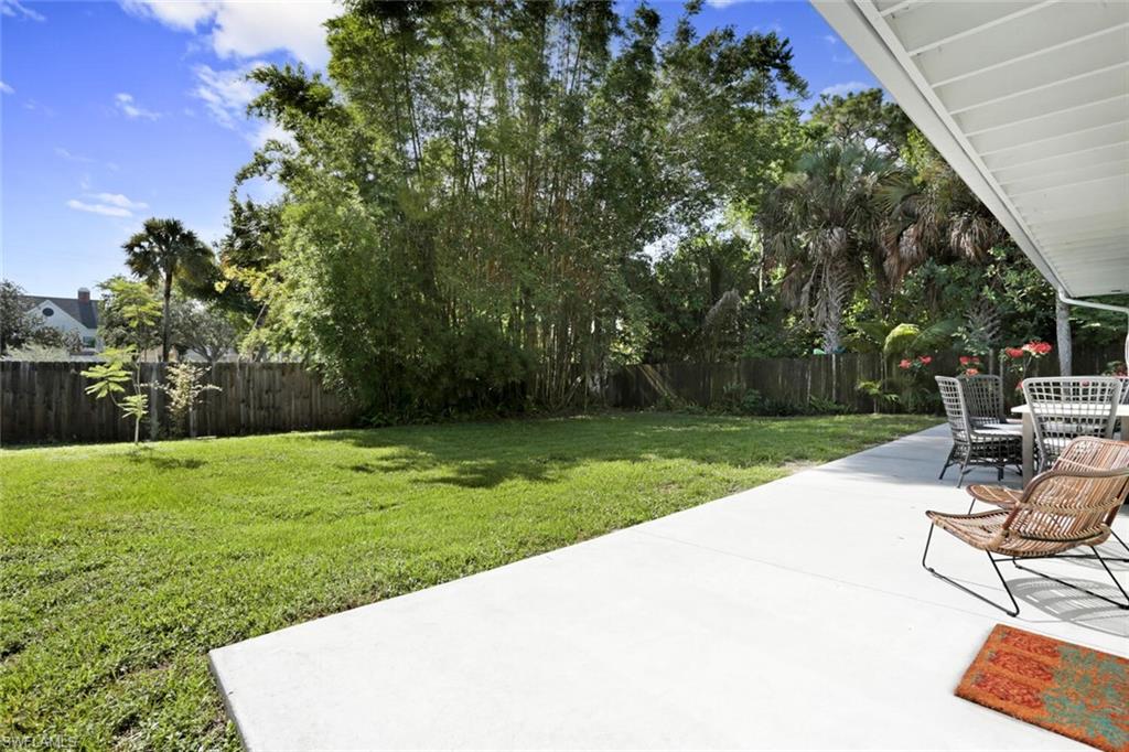 982 13th Street North Naples, FL 34102 - Photo 26 of 29 a view of a backyard with sitting area