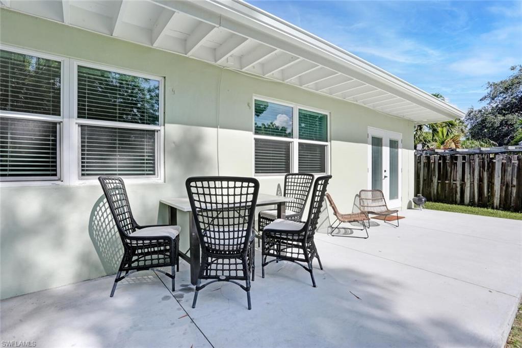982 13th Street North Naples, FL 34102 - Photo 27 of 29 a view of a patio with a table and chairs