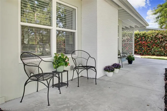 a view of a chairs and tables in patio