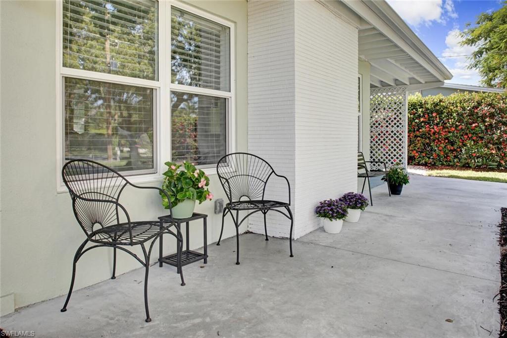 982 13th Street North Naples, FL 34102 - Photo 29 of 29 a view of a chairs and tables in patio