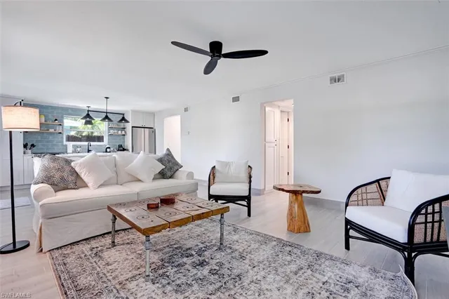 a living room with furniture and a rug