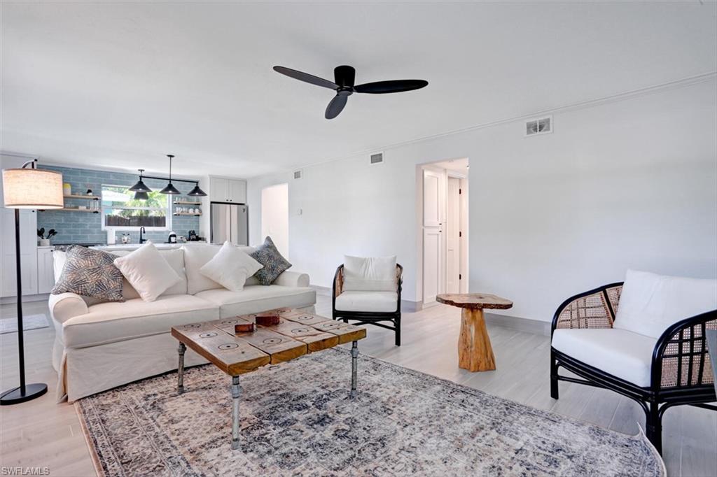 982 13th Street North Naples, FL 34102 - Photo 9 of 29 a living room with furniture and a rug