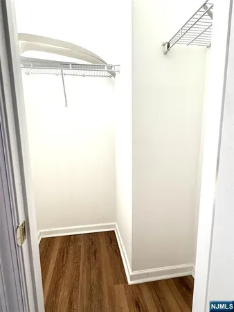 a bathroom with a shower a toilet and a sink