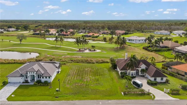 an aerial view of a house with a ocean view
