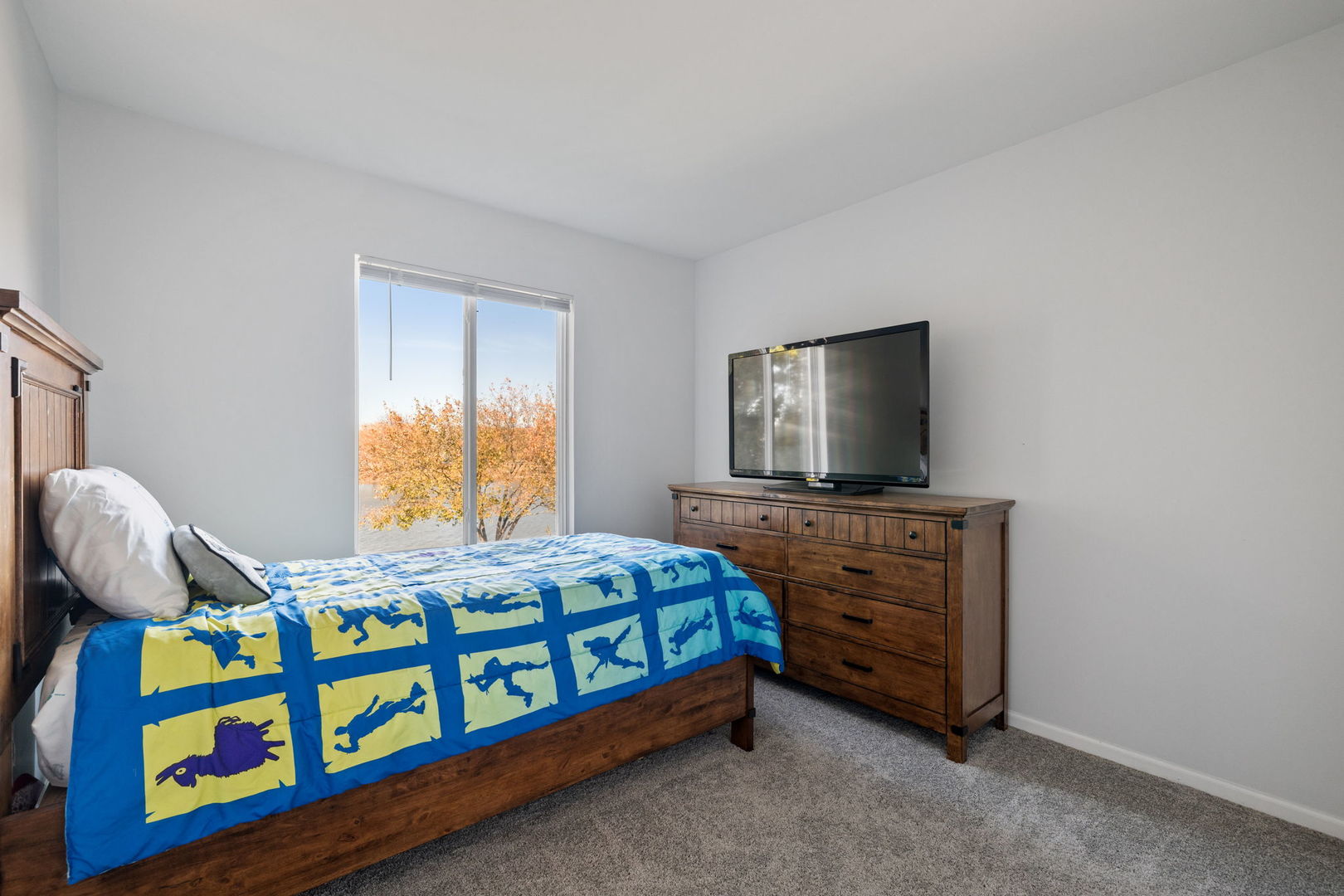 14058 South Hemingway Circle Plainfield, IL 60544 - Photo 12 of 23 a bedroom with a bed and a dresser in it