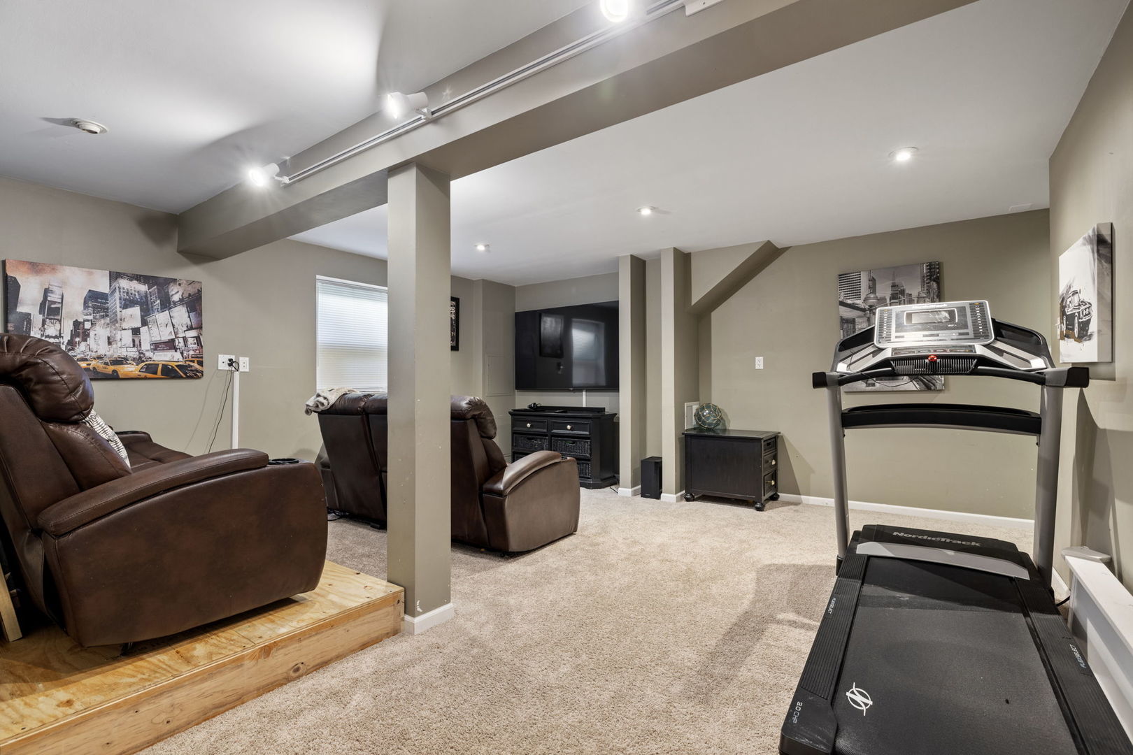 14058 South Hemingway Circle Plainfield, IL 60544 - Photo 15 of 23 a living room with furniture a flat screen tv and a refrigerator