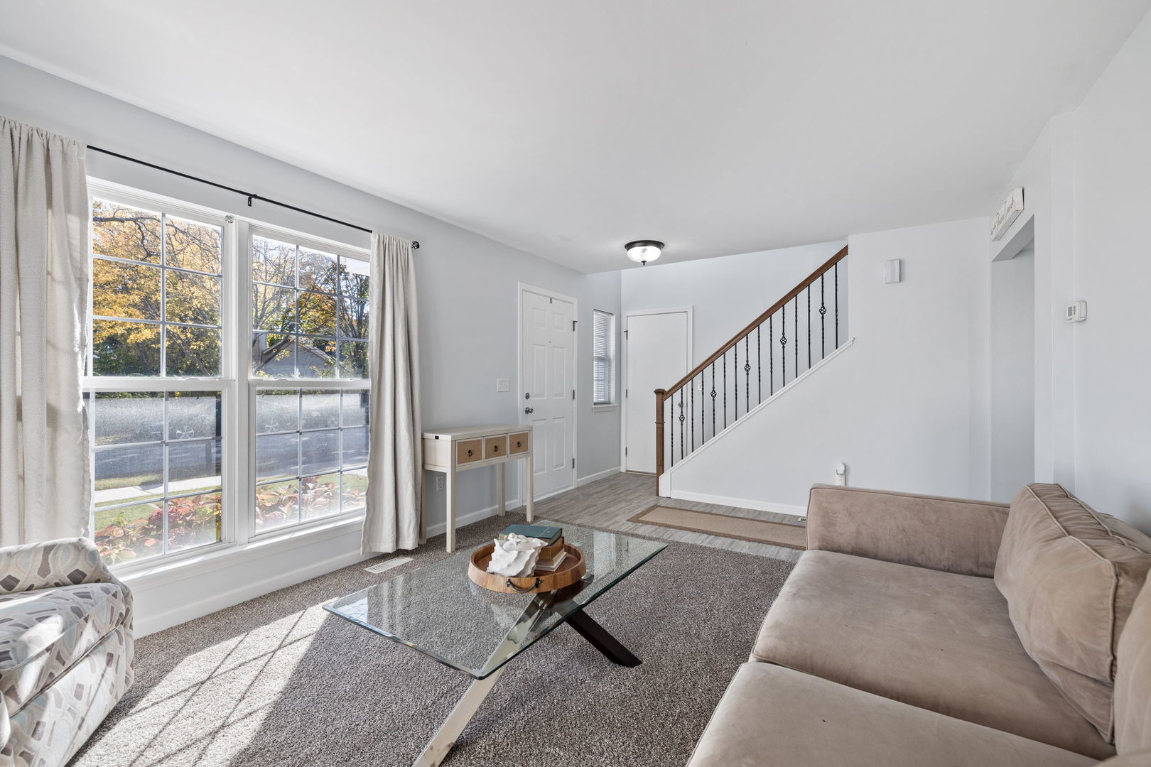 14058 South Hemingway Circle Plainfield, IL 60544 - Photo 2 of 23 a living room with furniture and a large window