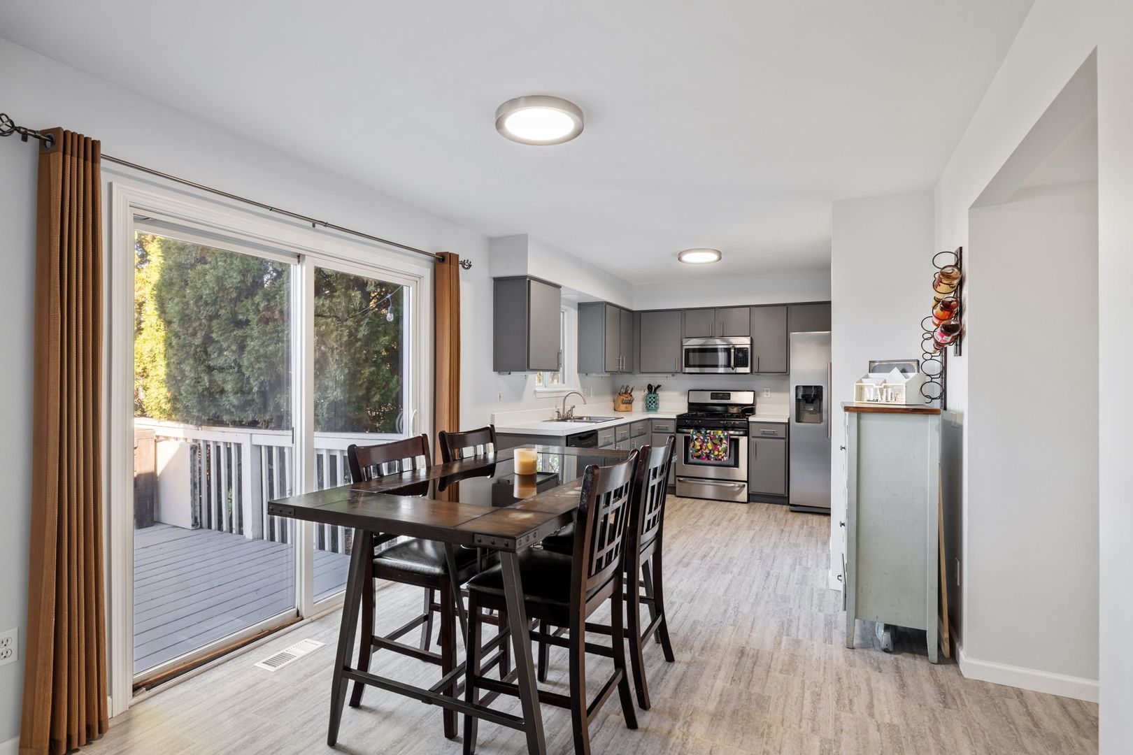 14058 South Hemingway Circle Plainfield, IL 60544 - Photo 7 of 23 a view of a dining room with furniture window and wooden floor