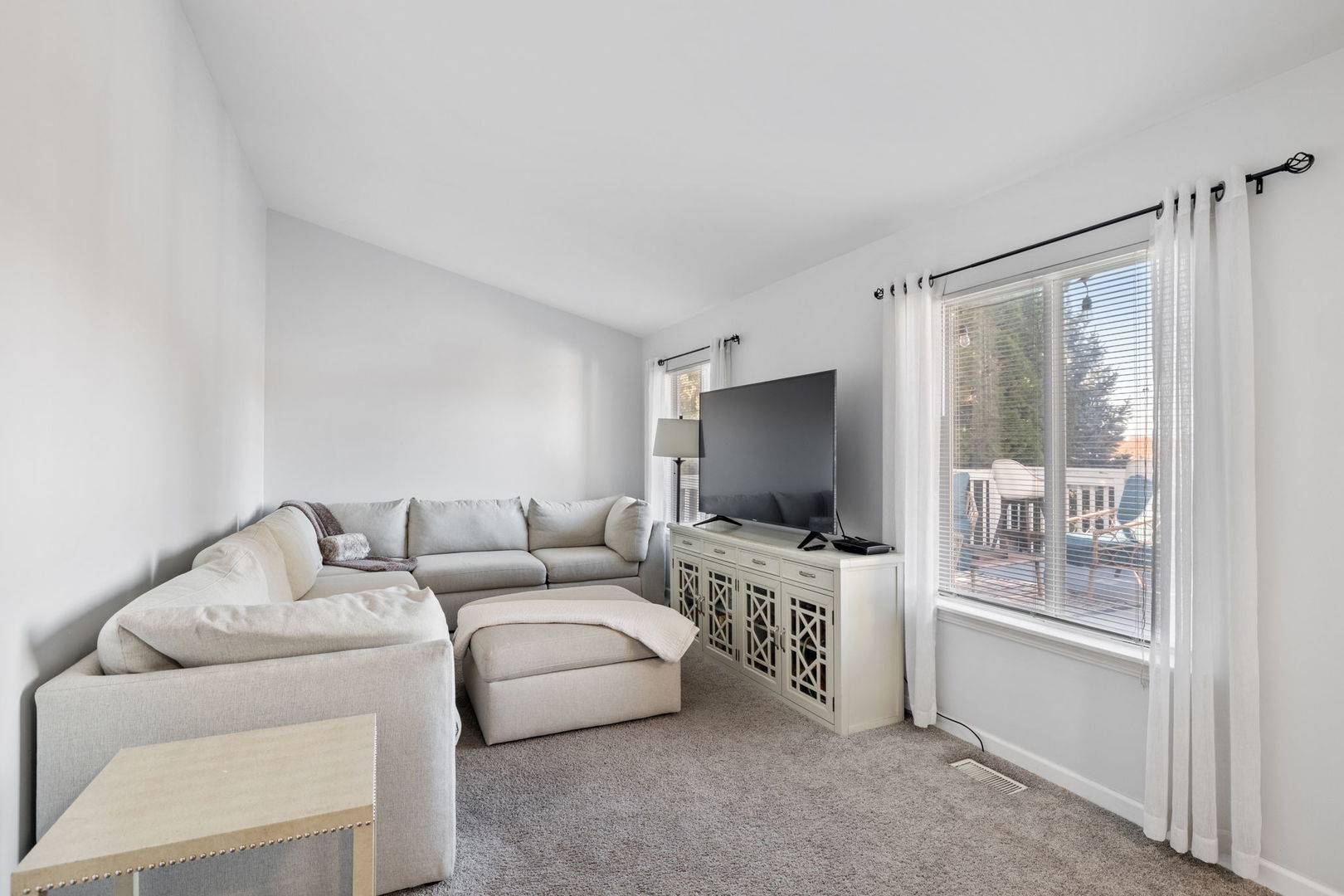 14058 South Hemingway Circle Plainfield, IL 60544 - Photo 8 of 23 a living room with furniture and a flat screen tv
