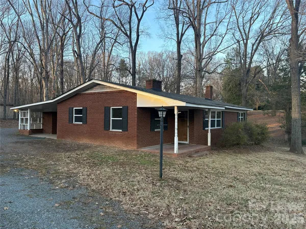 a house with trees in the background
