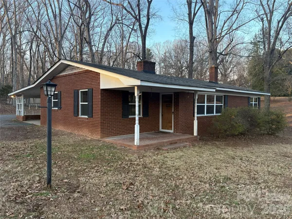 a house with trees in the background