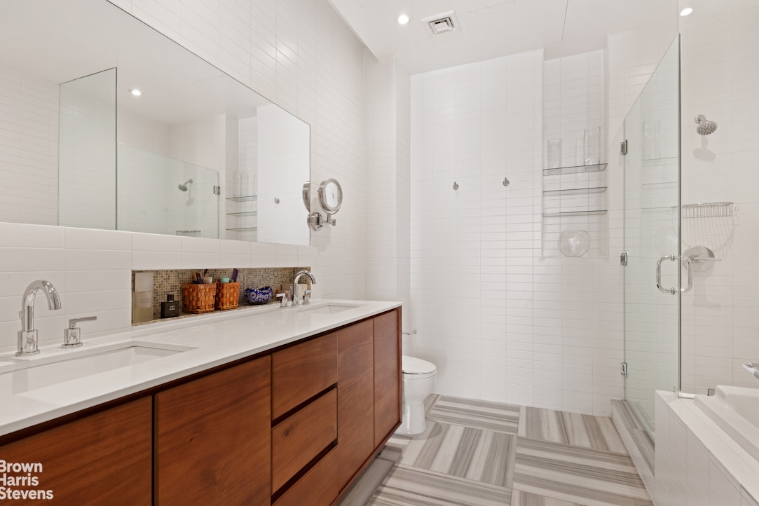 140 West 124th Street, Unit 8A Manhattan, NY 10027 - Photo 8 of 16 a kitchen with a sink and cabinets