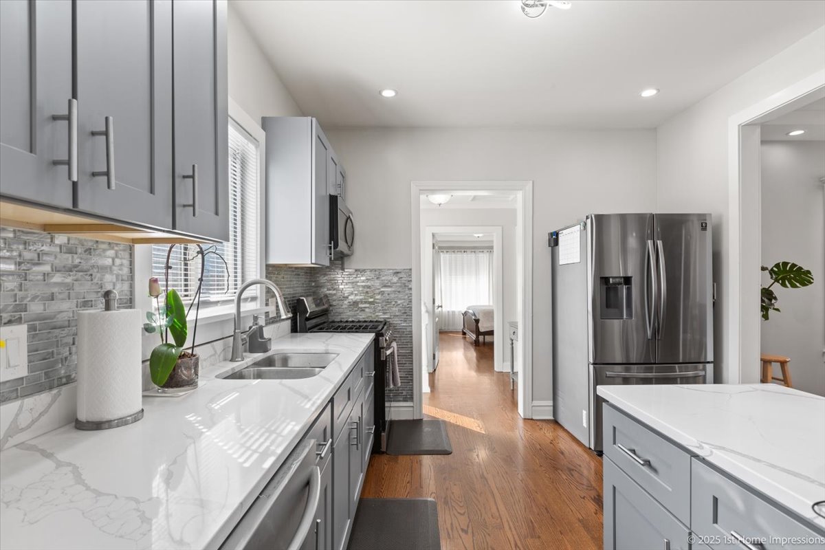 411 Herrick Road Riverside, IL 60546 - Photo 11 of 37 a kitchen with a sink stove and refrigerator