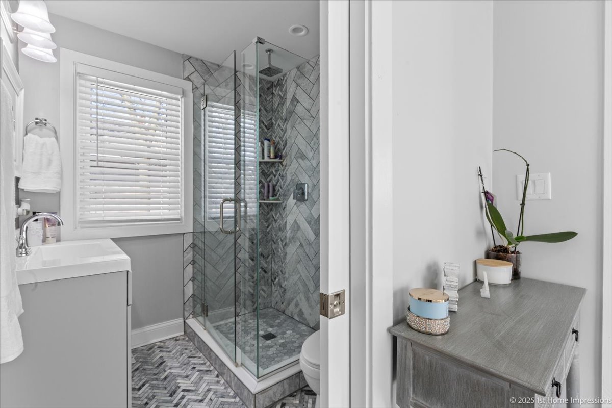 411 Herrick Road Riverside, IL 60546 - Photo 14 of 37 a bathroom with a sink and a mirror