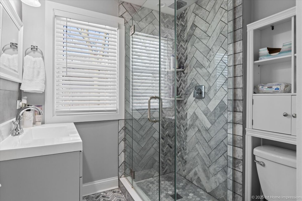 411 Herrick Road Riverside, IL 60546 - Photo 15 of 37 a bathroom with a sink and a mirror
