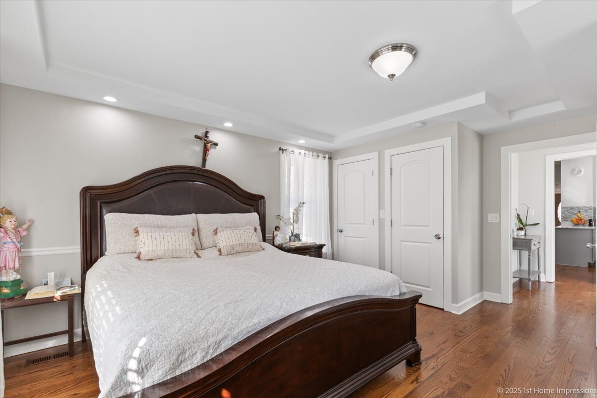 411 Herrick Road Riverside, IL 60546 - Photo 16 of 37 a bedroom with a bed and wooden floor