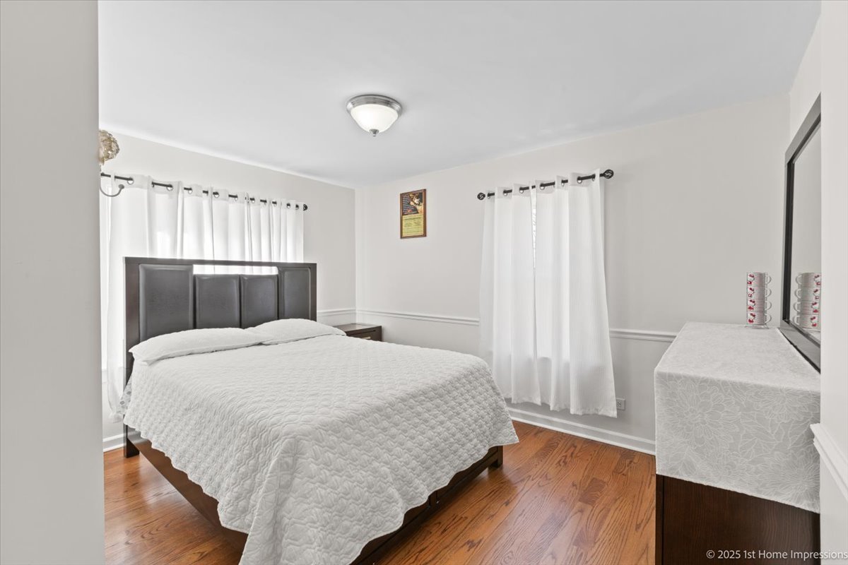 411 Herrick Road Riverside, IL 60546 - Photo 18 of 37 a bedroom with a bed and a dresser