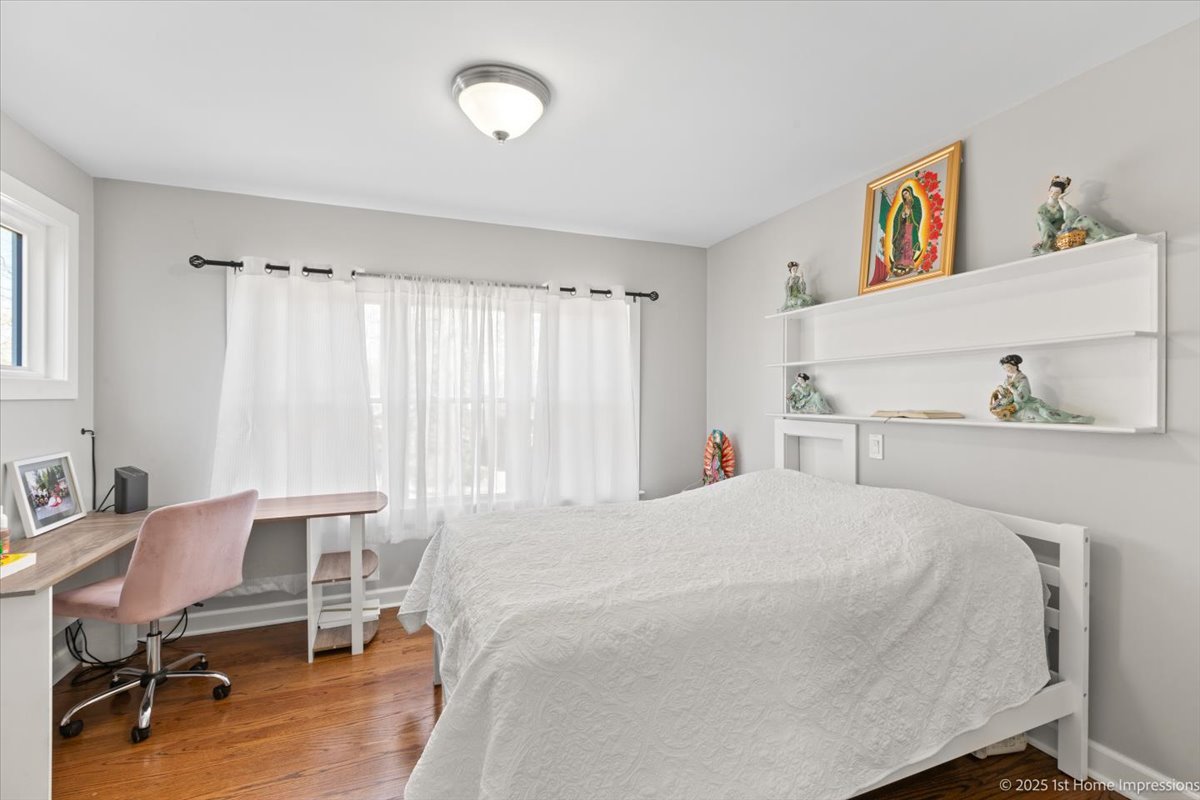 411 Herrick Road Riverside, IL 60546 - Photo 20 of 37 a bedroom with a bed and a chair in it