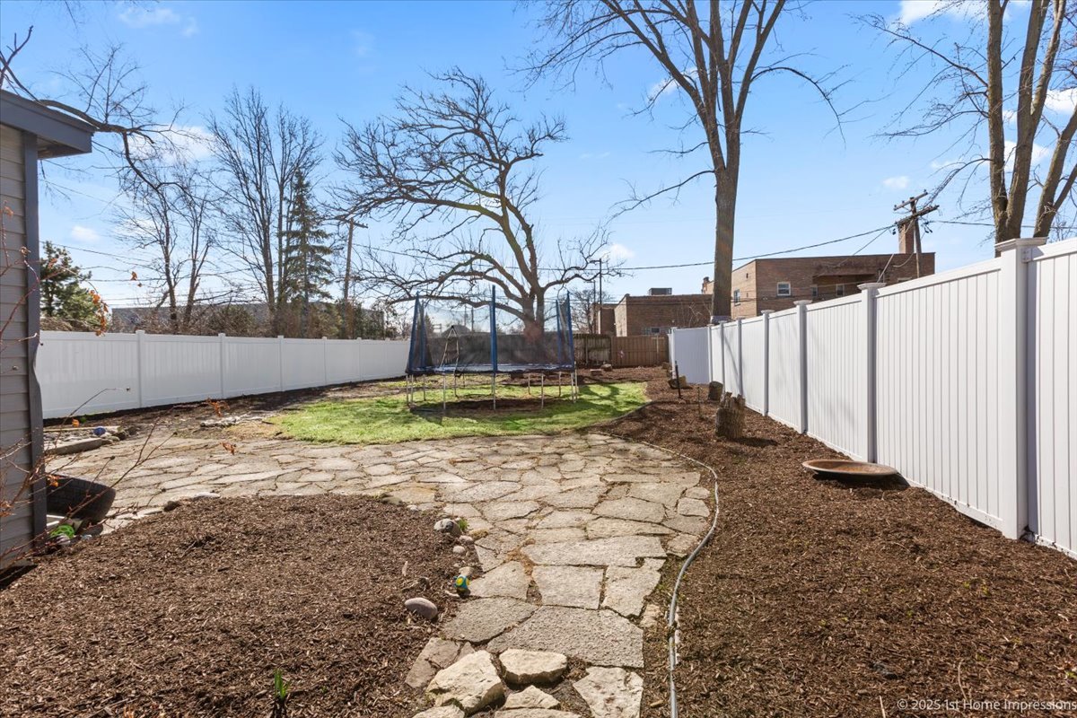 411 Herrick Road Riverside, IL 60546 - Photo 30 of 37 a view of a yard with wooden fence