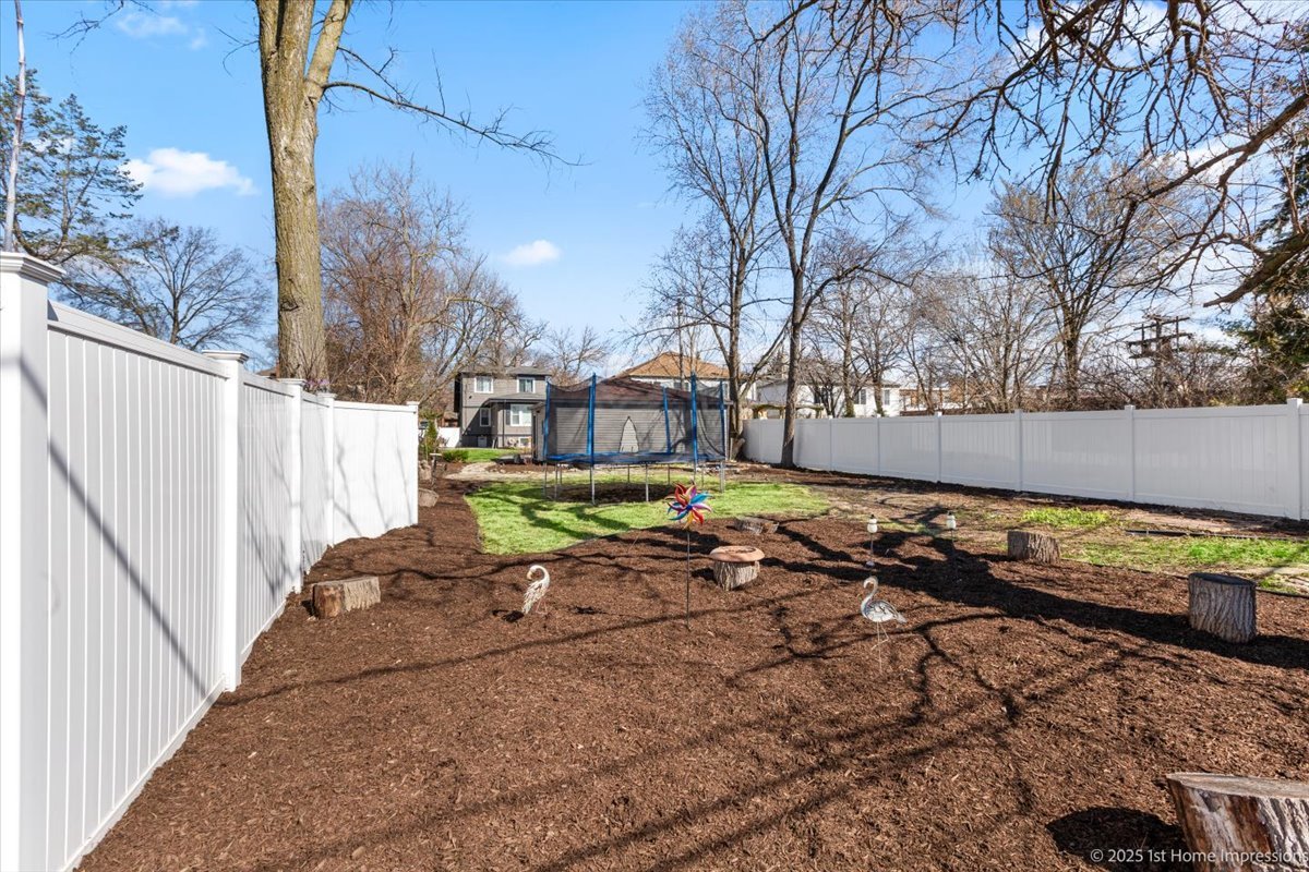 411 Herrick Road Riverside, IL 60546 - Photo 31 of 37 a view of a backyard with wooden fence