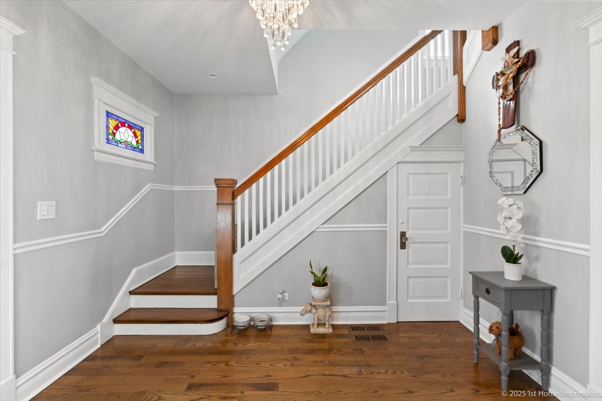 411 Herrick Road Riverside, IL 60546 - Photo 4 of 37 a view of entryway and hall with wooden floor