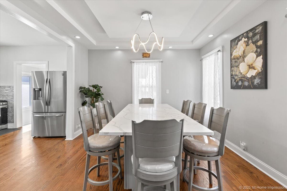 411 Herrick Road Riverside, IL 60546 - Photo 7 of 37 a view of a dining room with furniture window and wooden floor